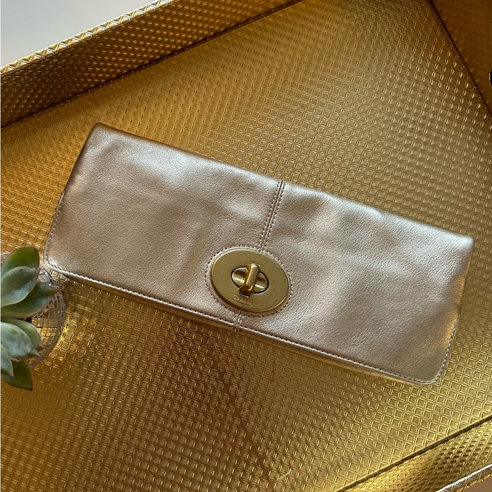 COACH Coach metallic gold fold over clutch purse.